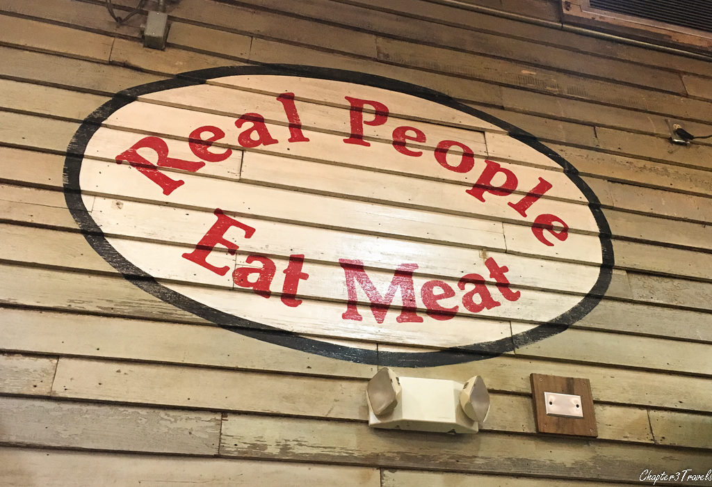 Sign that says "Real people eat meat."