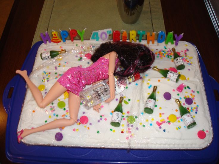Birthday cake with Barbie doll passed out holding onto vodka bottle.