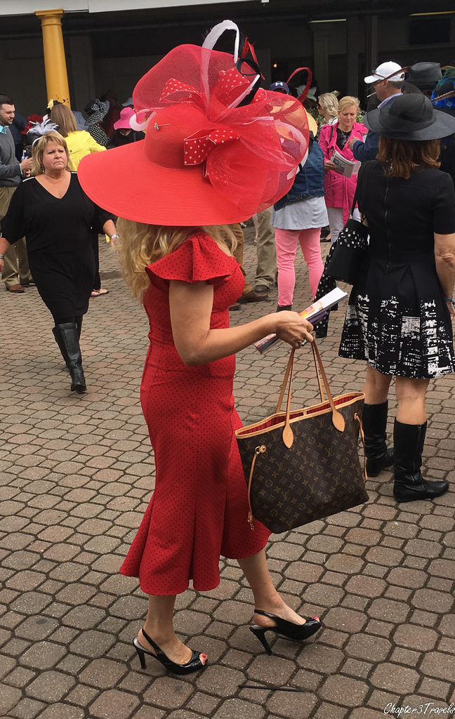 Woman wearing a very large ornate hat at the Kentucky Derby