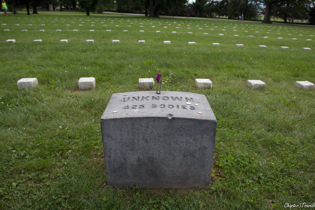 Plaque and grave markers at Soldiers National Cemetery in Gettysburg, Pennsylvania