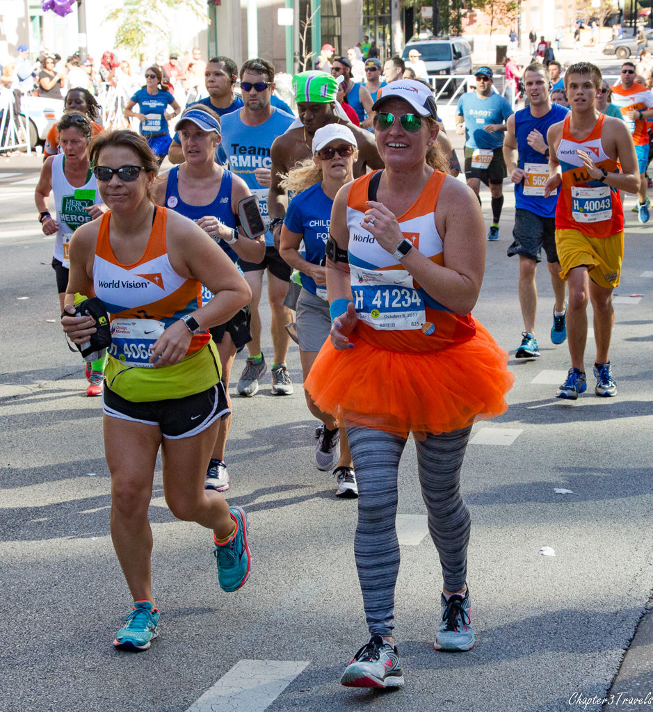 Runners wearing "World Vision" shirts
