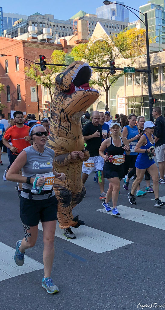 a runner in a T-Rex costume at the 2017 Chicago Marathon