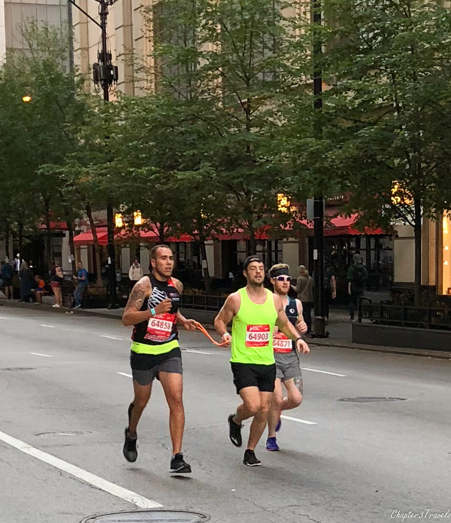A blind runner running next to a guide at the Chicago Marathon