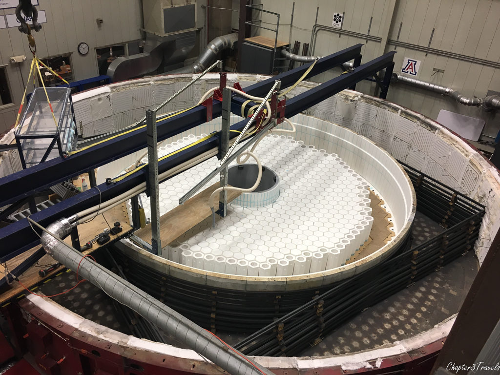Partially constructed honeycomb shaped structure inside circular oven at Mirror Lab in Tucson