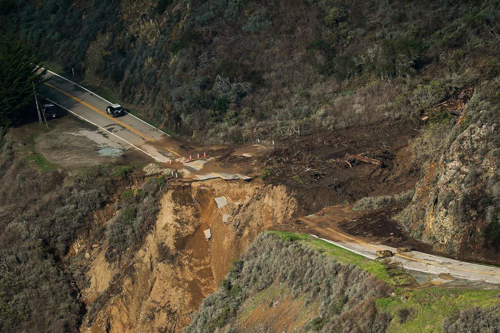 Aerial view of large section of roadway missing from Pacific Coast Highway